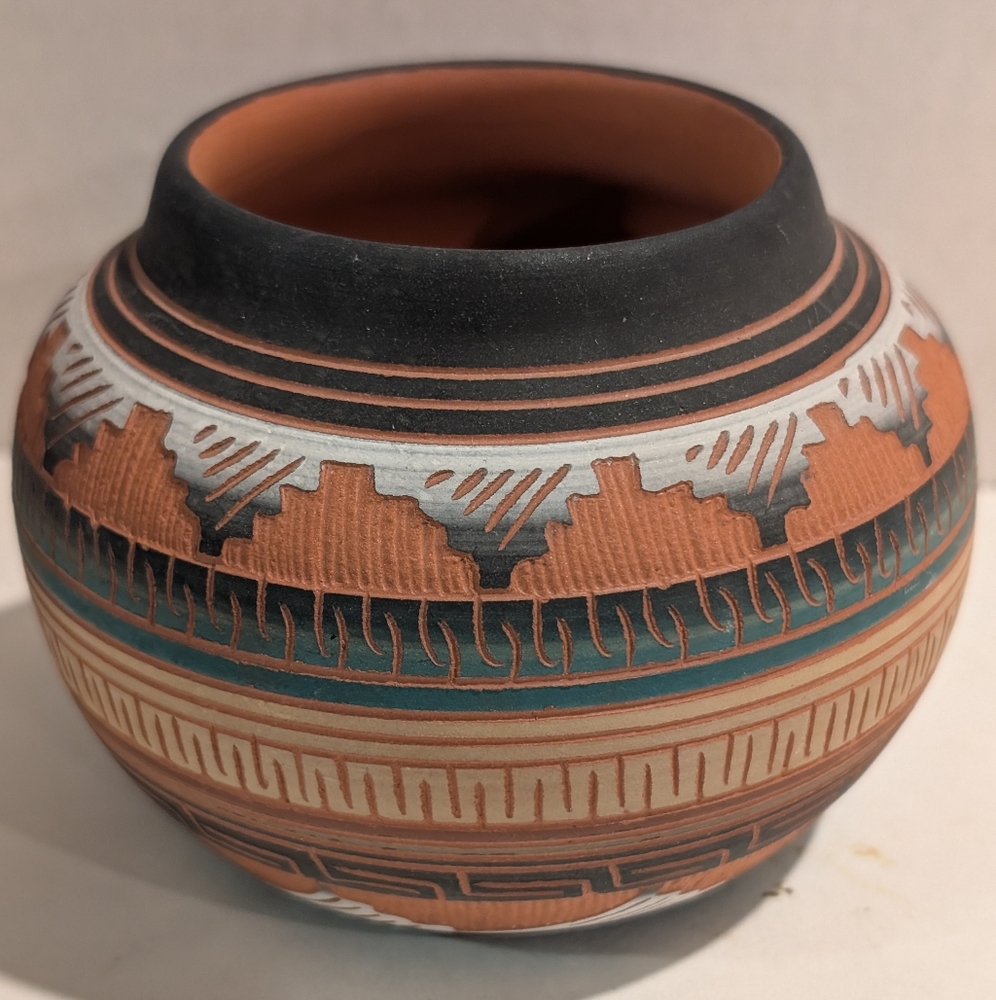 A piece of Native American Navajo etched pottery, likely a vase or seed pot.